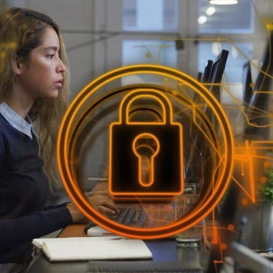 Image of security padlock icon against biracial woman using computer at office. Cyber security Firewalls and Encryption