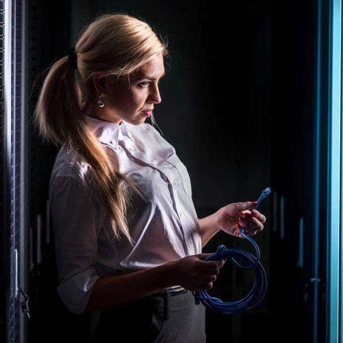 Server Security Young engineer businesswoman in network Server Security room.