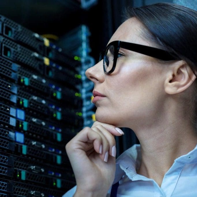 Serious operator looking at the equipment My attention. Concentrated thoughtful woman thinking and looking at the equipment